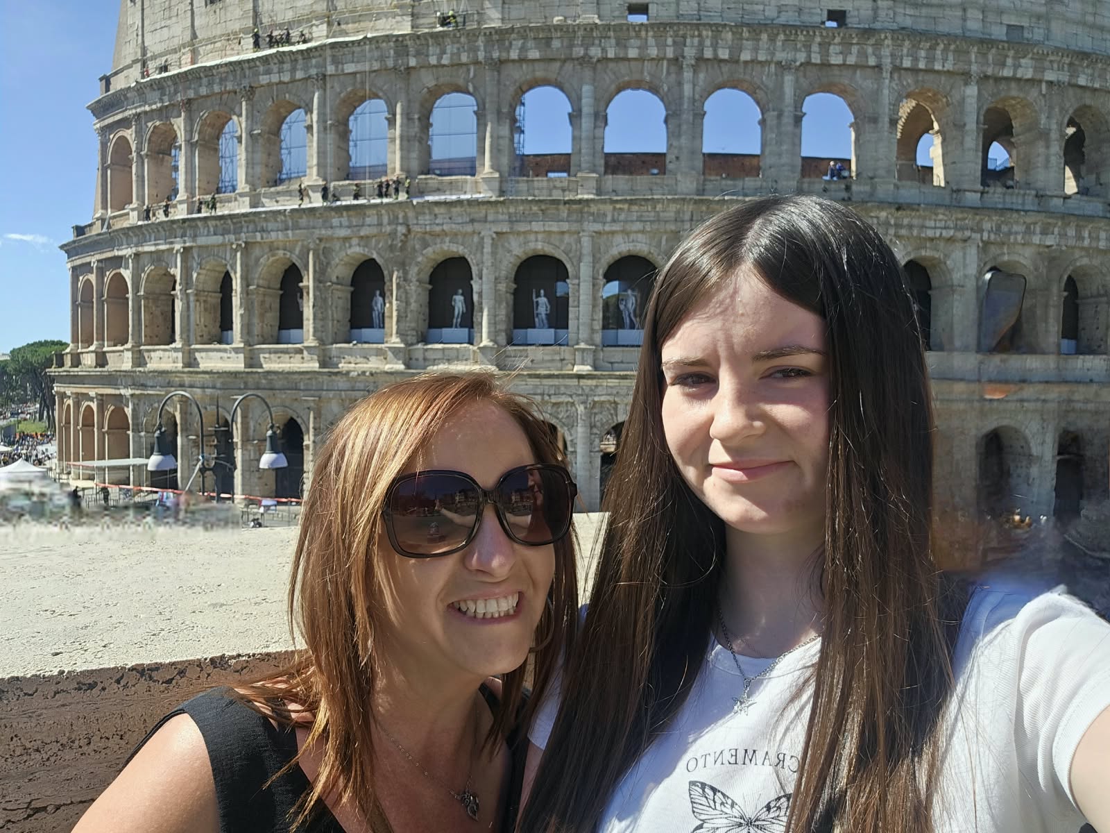 Kelli and Tailer Grinter in front of the Colosseum in Rome